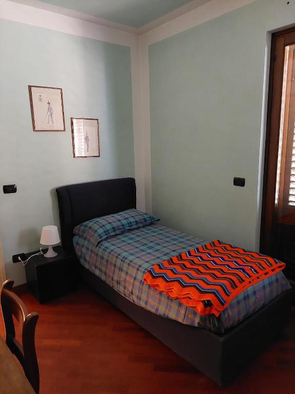 Postel nebo postele na pokoji v ubytování Casa Delle Coccole