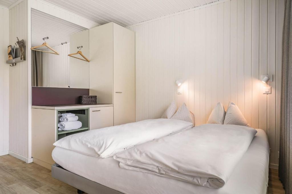 Postel nebo postele na pokoji v ubytování Wanderlust Guesthouse