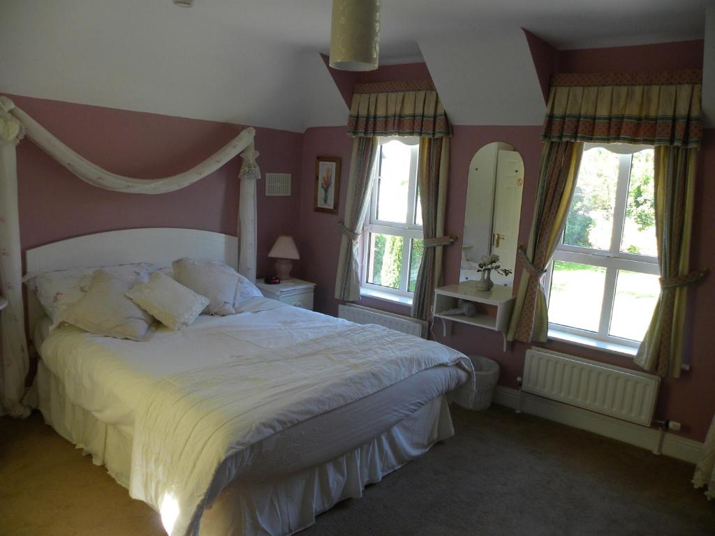 Postel nebo postele na pokoji v ubytování Maple Lodge