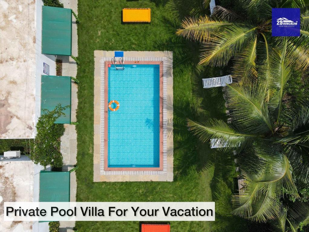 an overhead view of a swimming pool with palm trees at Boutique Room At Bora Bora in Vaishet