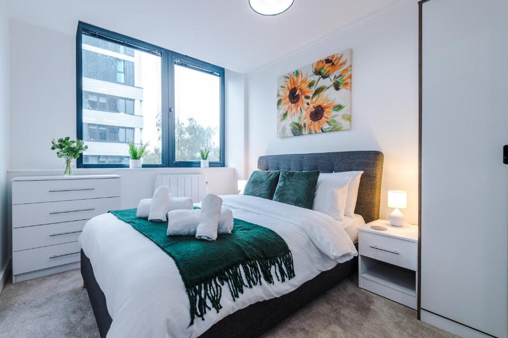 a bedroom with a large bed and a window at NEW! Stylish 2-bed apartment in Manchester by 53 Degrees Property - Amazing location, Ideal for Small Groups - Sleeps 4! in Manchester