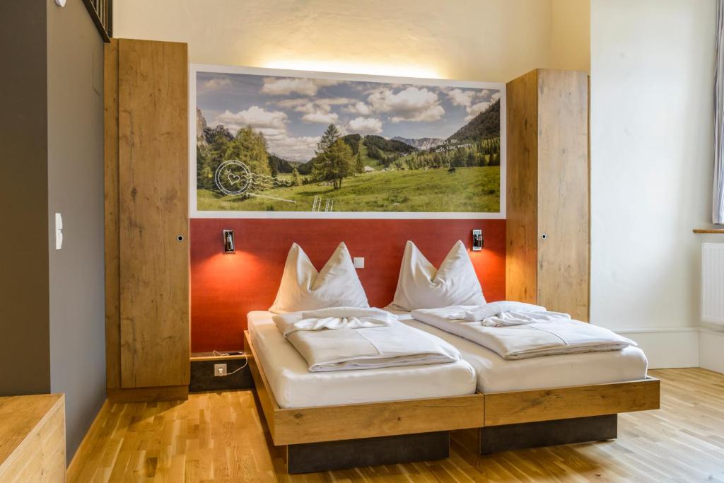 Postel nebo postele na pokoji v ubytování JUFA Hotel Spital am Pyhrn