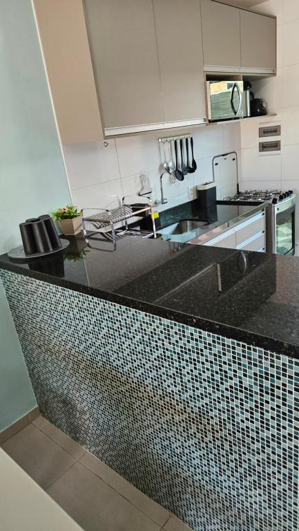 Kuchyň nebo kuchyňský kout v ubytování Cantinho do Atalaia à 650 metros da praia - Seu conforto fora de casa