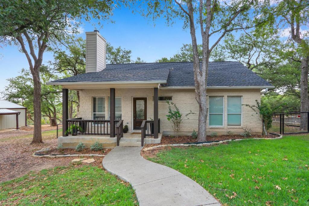 a house with a walkway in front of it at Deer Haus Retreat in New Braunfels