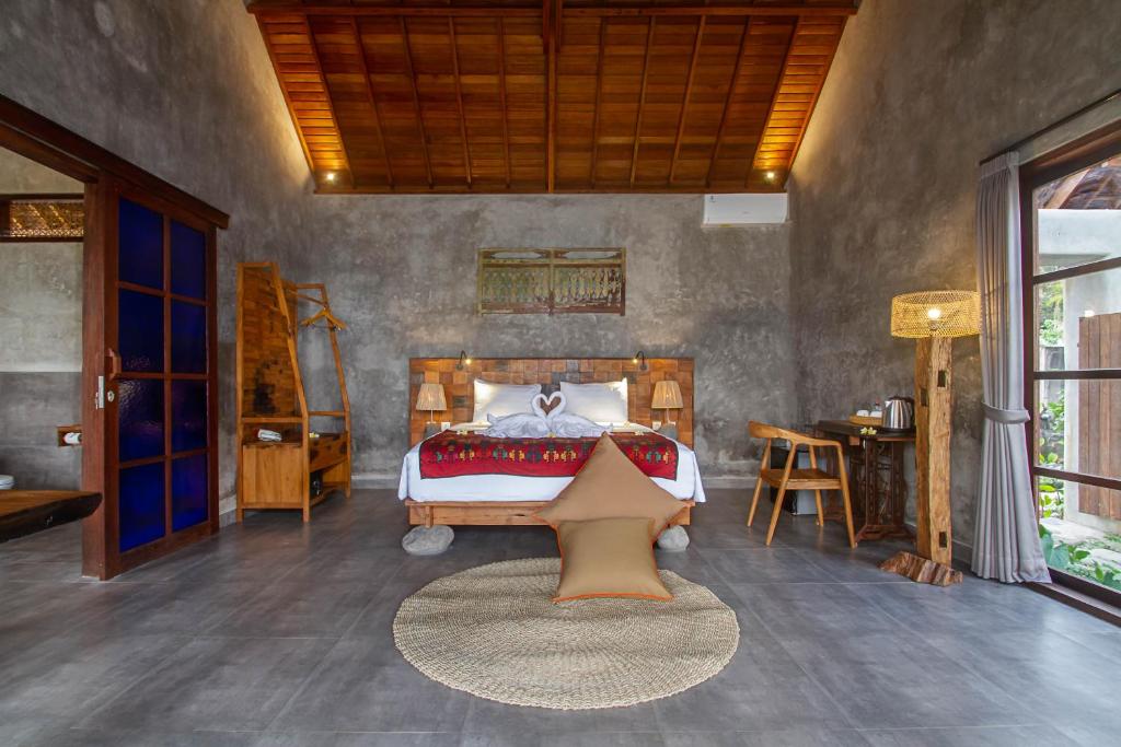 Postel nebo postele na pokoji v ubytování Ubud Luwih Nature Retreat