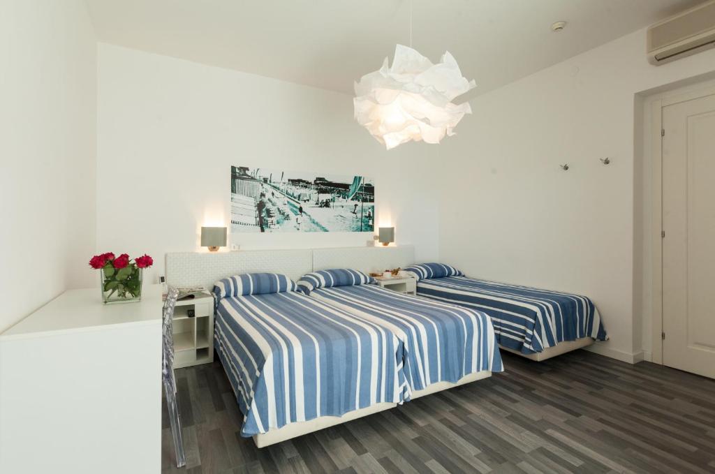 Postel nebo postele na pokoji v ubytování Albergo alla Spiaggia