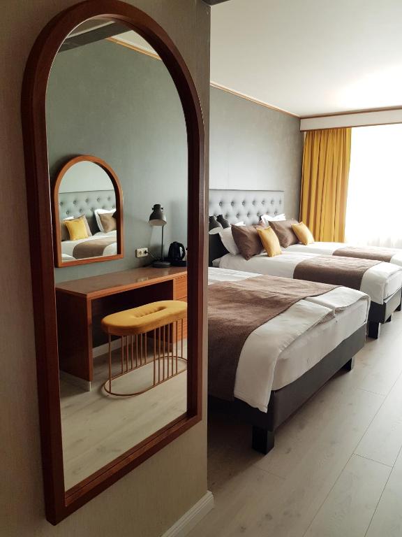Postel nebo postele na pokoji v ubytování Hotel Ísland – Spa & Wellness Hotel