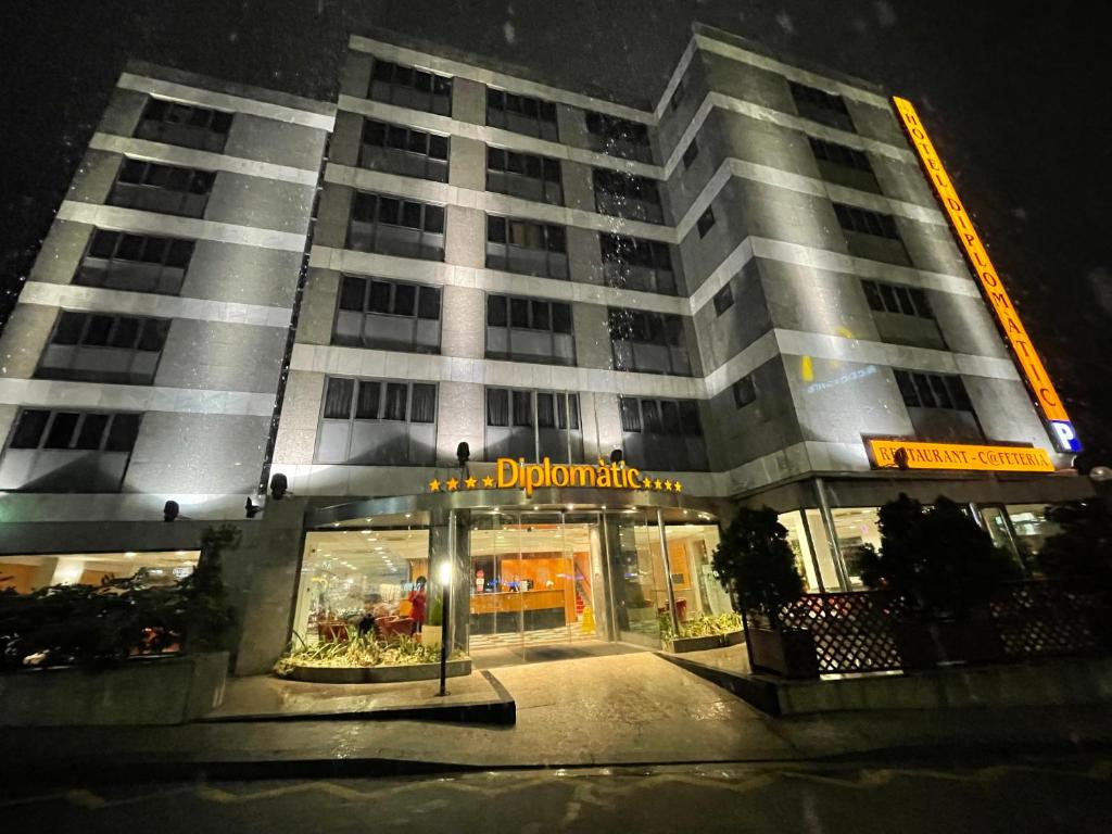 a large building at night with a sign on it at Zenit Diplomatic in Andorra la Vella