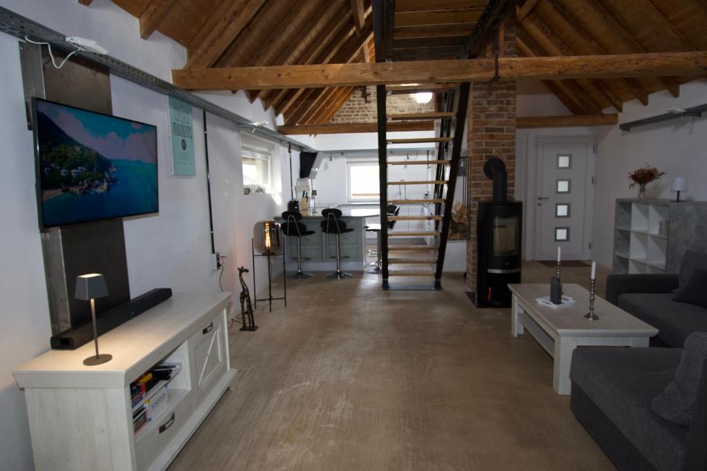 TV a/nebo společenská místnost v ubytování Mini-Loft in schöner Voreifel