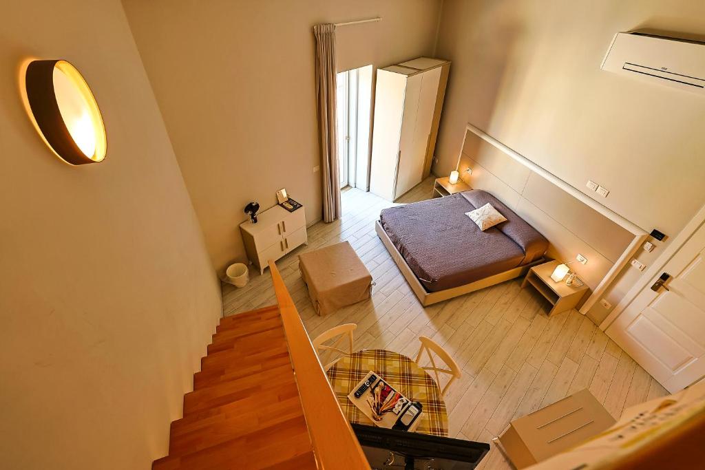 Postel nebo postele na pokoji v ubytování Le Suite