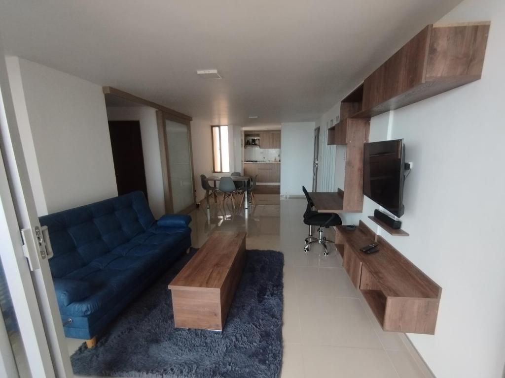 TV a/nebo společenská místnost v ubytování Riohacha III apartamento comodo y seguro perfectos para trabajar o vacacionar con balcón FRENTE AL MALECON