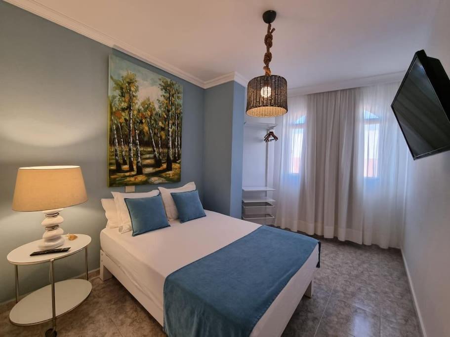 Posteľ alebo postele v izbe v ubytovaní Vintage & Deluxe Apartments