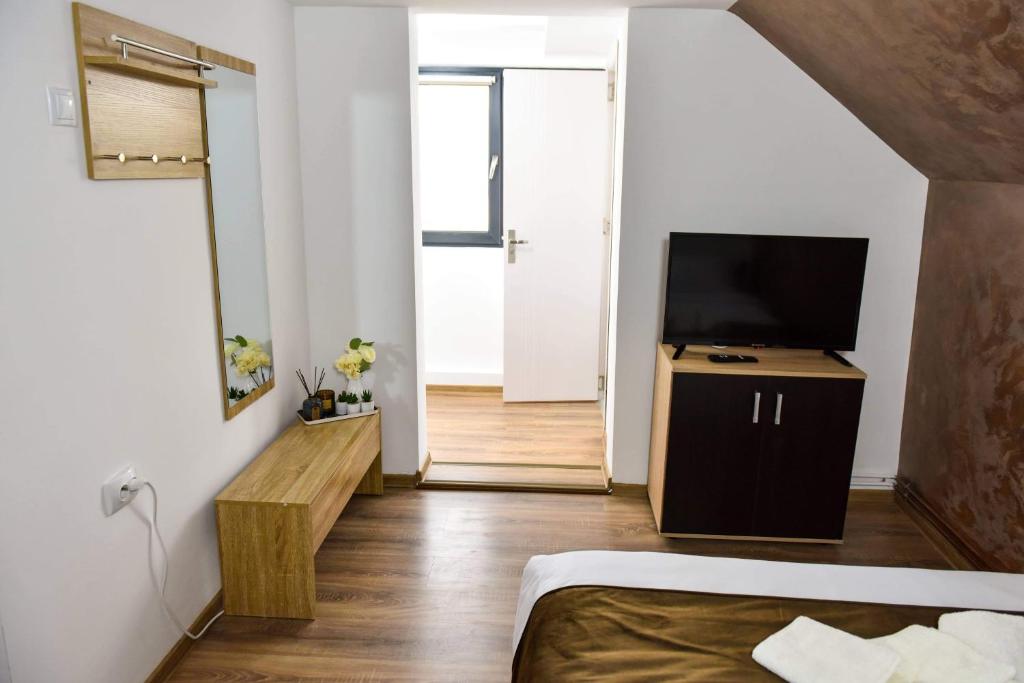 TV o dispositivi per l'intrattenimento presso UpForest Guesthouse