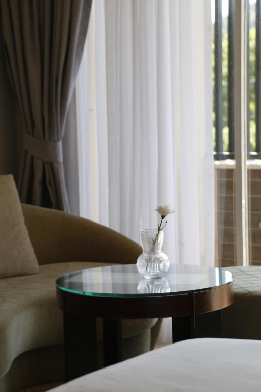 Postel nebo postele na pokoji v ubytování The Langstan Suites