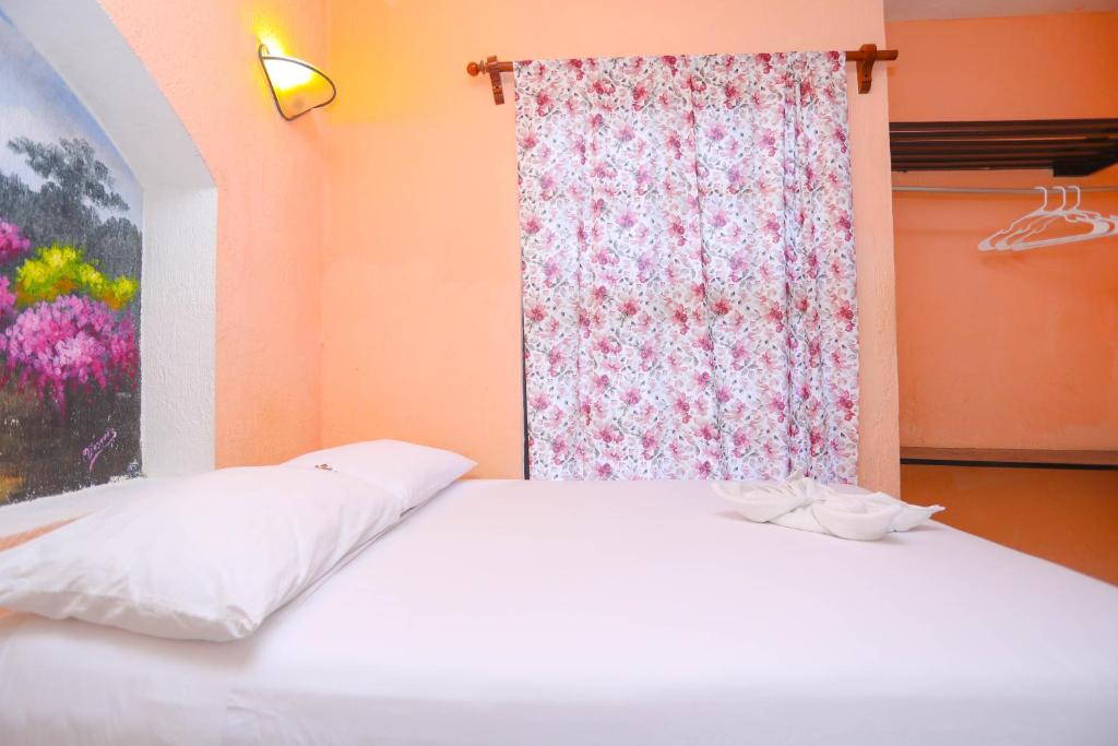 Postel nebo postele na pokoji v ubytování Hotel Hacienda Cancun