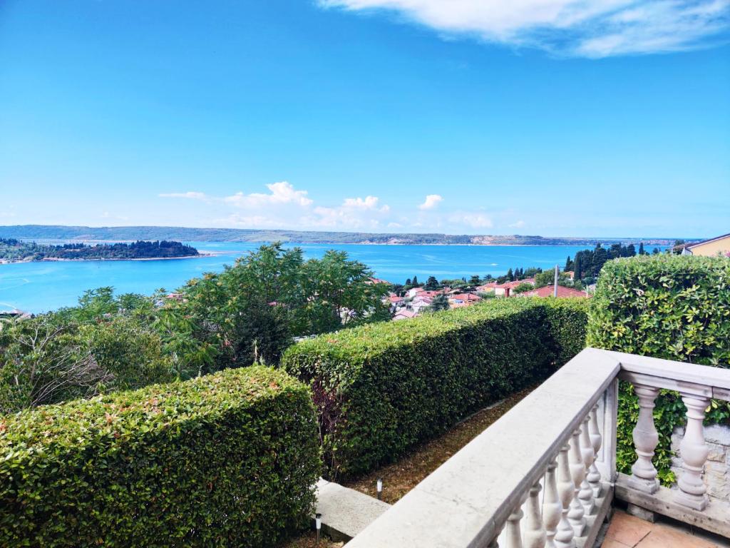 a balcony with a view of the water at VILLA GOLD ISTRA in Portorož