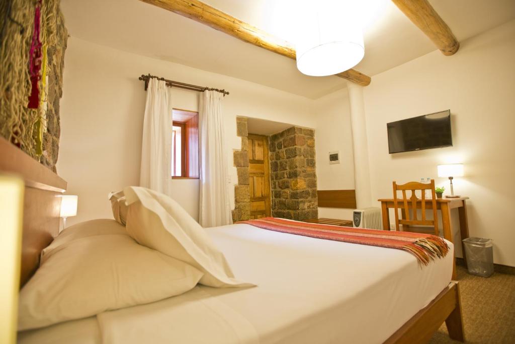 Postel nebo postele na pokoji v ubytování Tierra Viva Cusco Centro