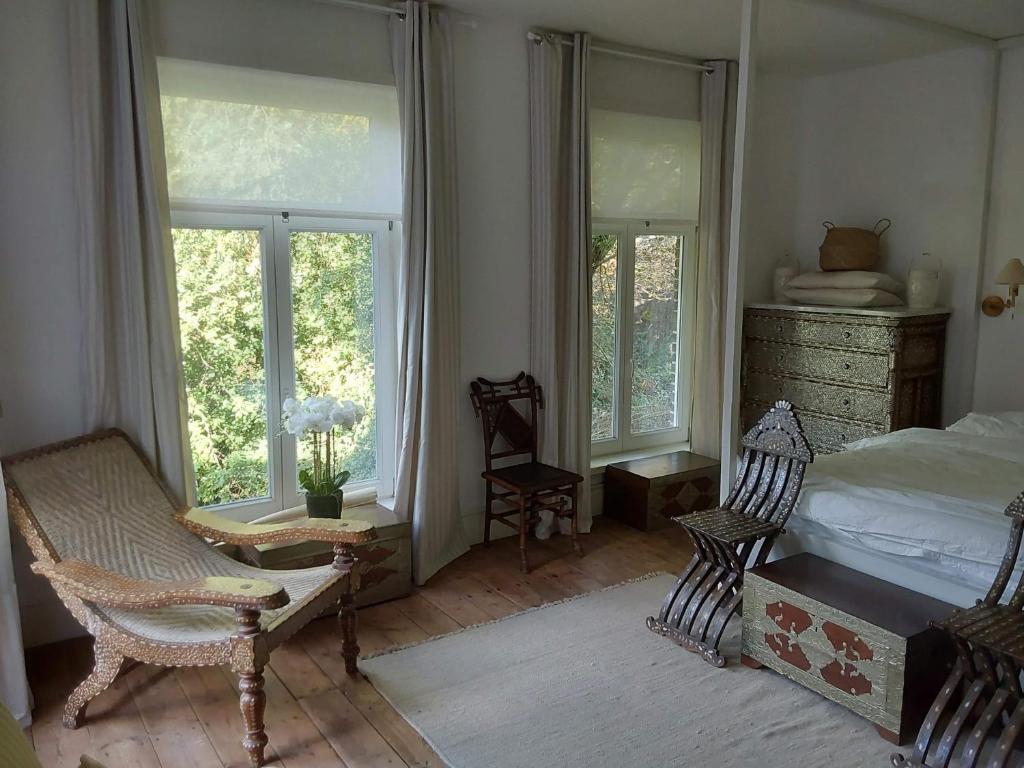 Postel nebo postele na pokoji v ubytování Kasteel Sint-Flora