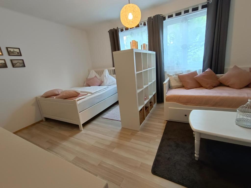 Postel nebo postele na pokoji v ubytování Ferienwohnung Strohblume