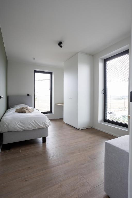 Postel nebo postele na pokoji v ubytování NIEUW - De Grenspaal WEST 6P 5 min Maastricht - Sauna - Laadpaal