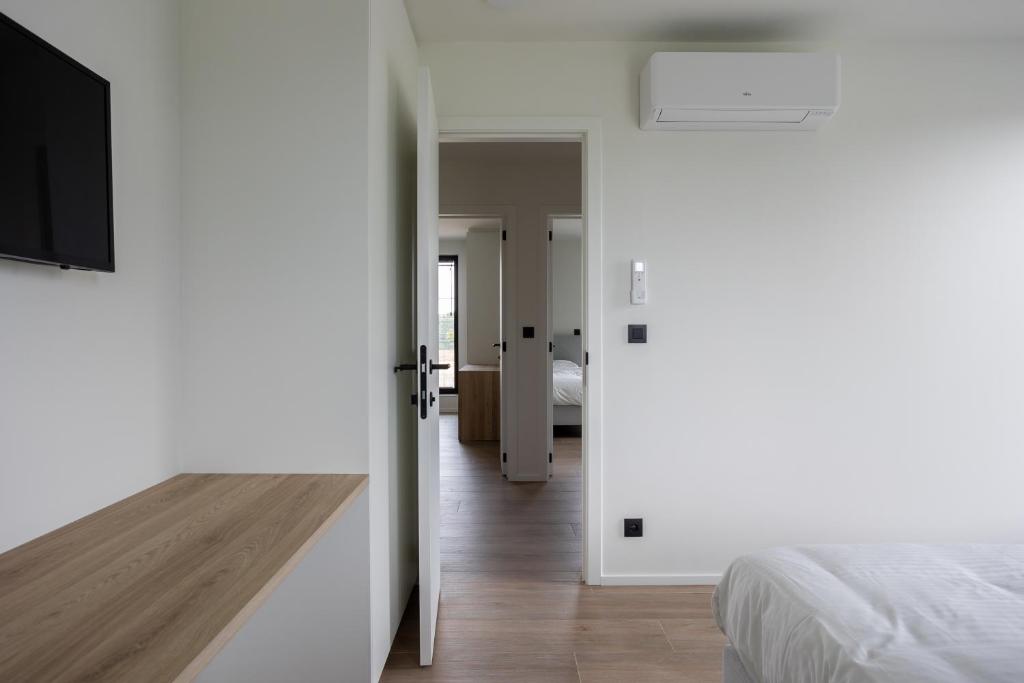 Postel nebo postele na pokoji v ubytování NIEUW - De Grenspaal WEST 6P 5 min Maastricht - Sauna - Laadpaal