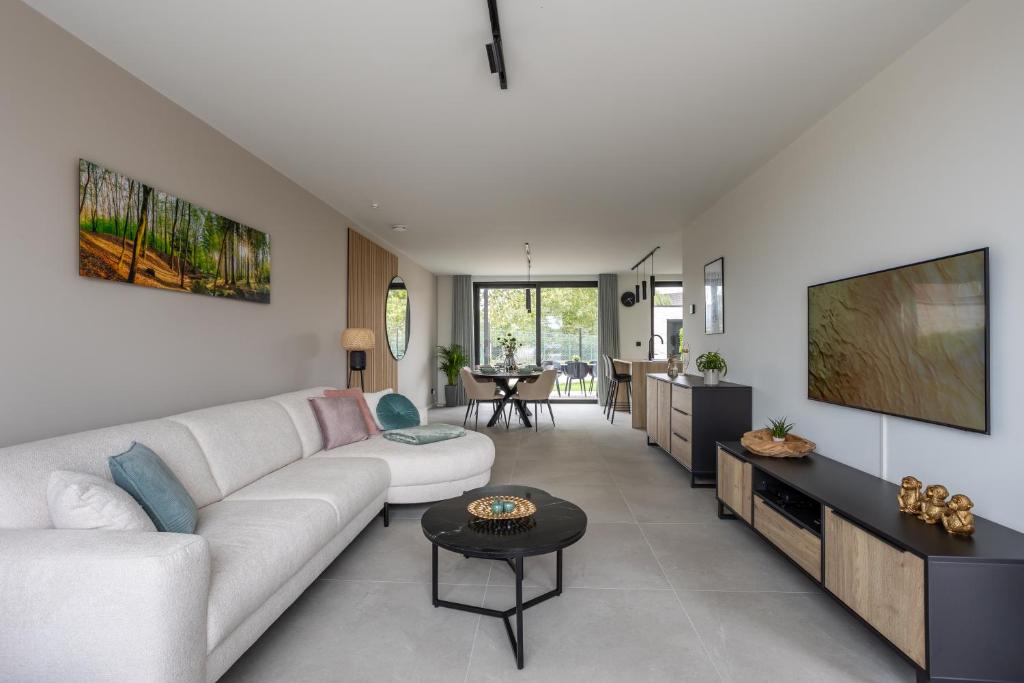 Posezení v ubytování NIEUW - De Grenspaal WEST 6P 5 min Maastricht - Sauna - Laadpaal
