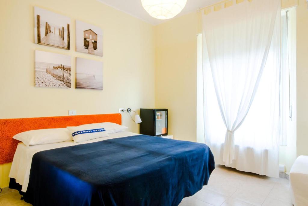 Postel nebo postele na pokoji v ubytování Albergo Villa Gaia