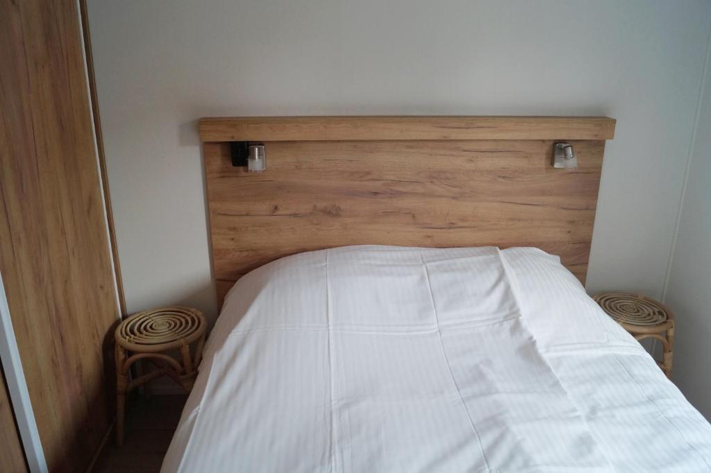 Postel nebo postele na pokoji v ubytování Chalet 't Zwaluwnest