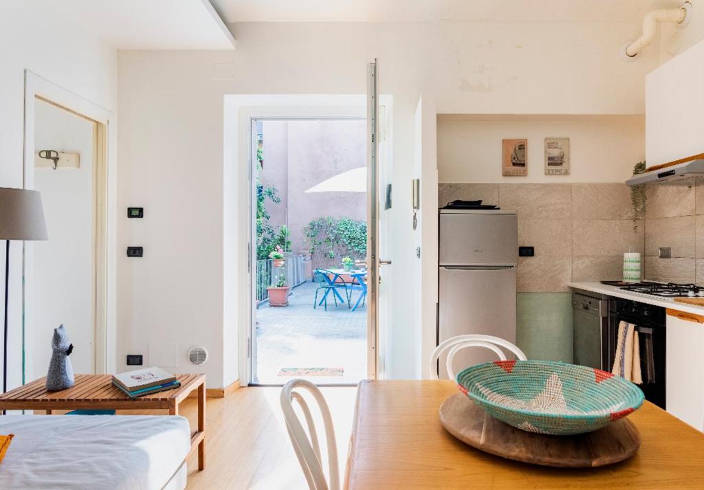 a kitchen with a table with a bowl on top of it at Casa Pellico in Turin