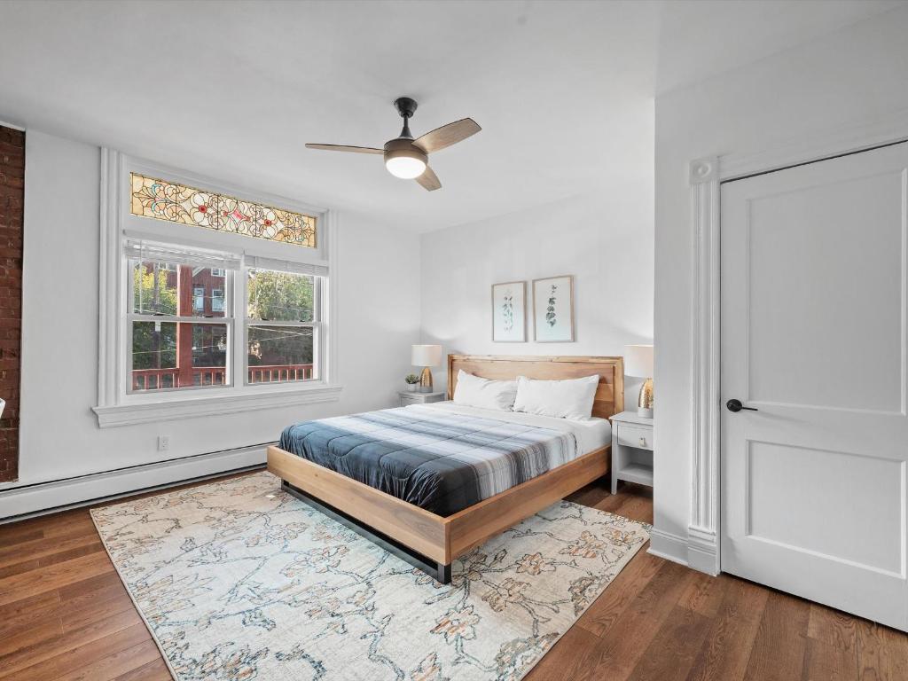 a bedroom with a bed and a window at Shadyside, Pittsburgh, Modern and Accessible 2 Bedroom Unit2 with Free Parking in Pittsburgh