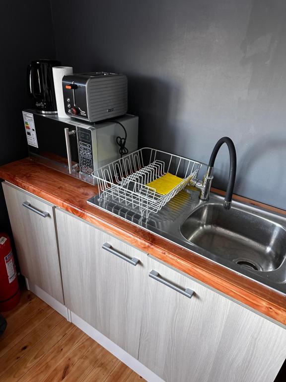 Kuchyň nebo kuchyňský kout v ubytování Hostal y Cabañas Mirando al Mar