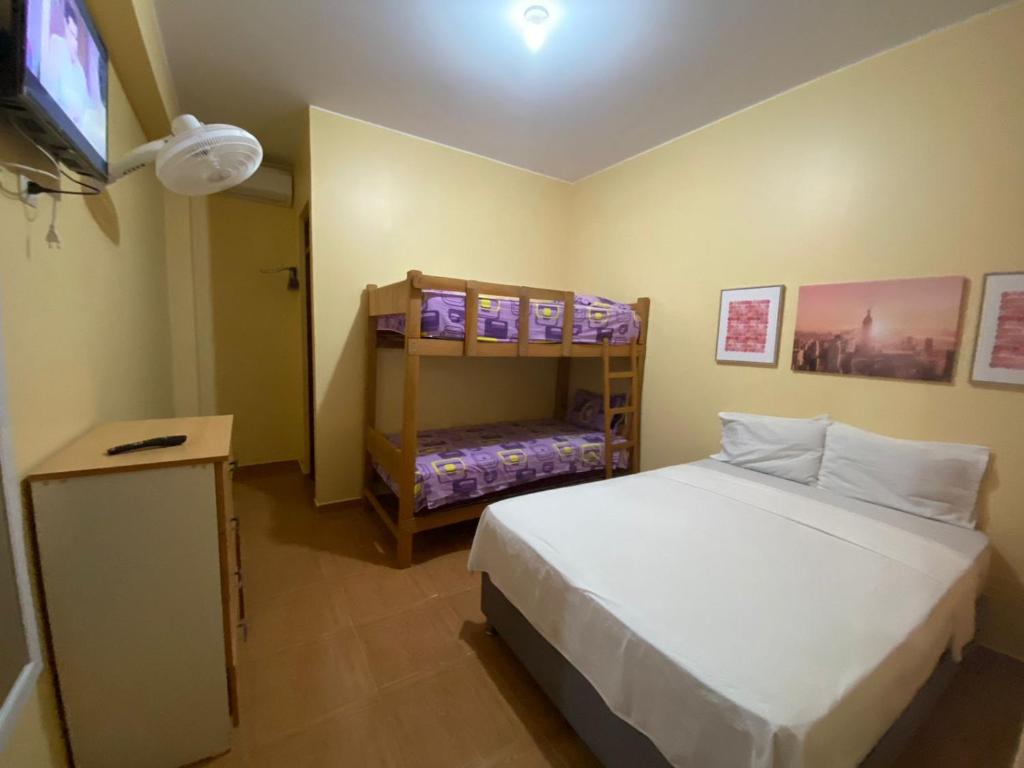 Postel nebo postele na pokoji v ubytování Hospedaje Ola Marina