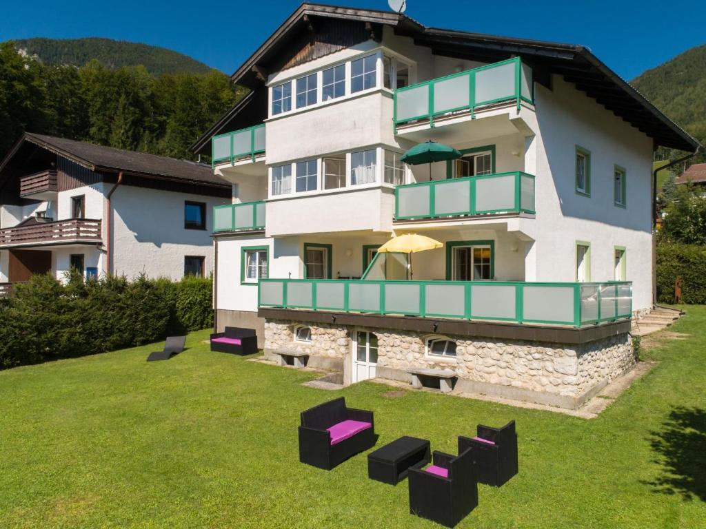 a large house with a lawn in front of it at Landhaus Leitzinger EG2 in St. Wolfgang