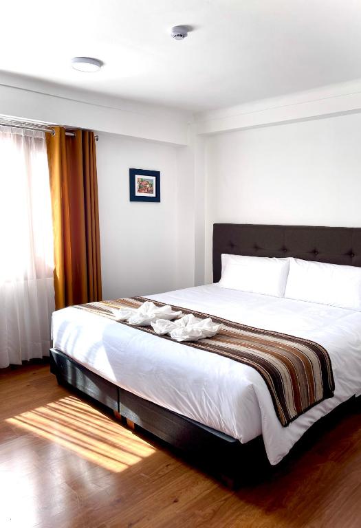 Postel nebo postele na pokoji v ubytování Hotel Andes de Urubamba