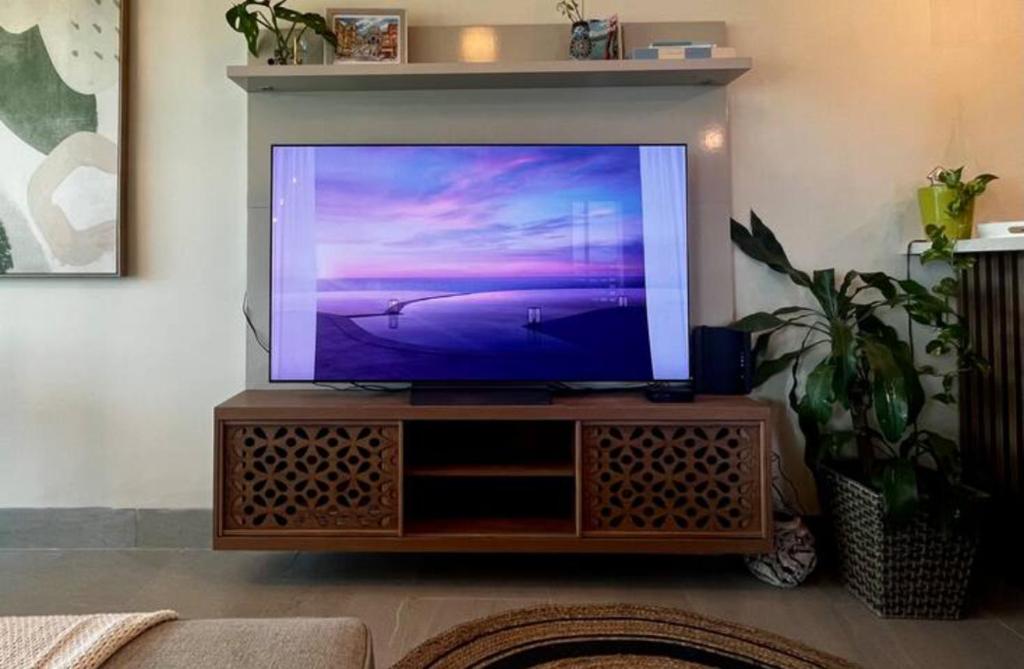 TV a/nebo společenská místnost v ubytování Playa Escondida: Confort y relax en el Caribe
