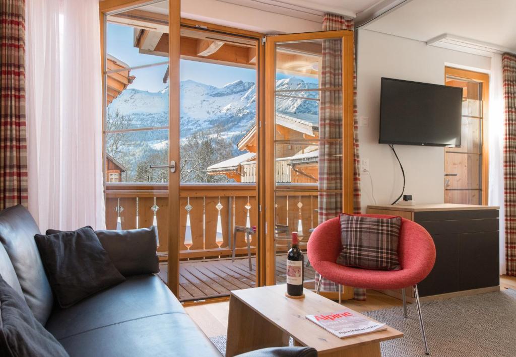 a living room with a view of a mountain at Panoramapark Soleil F Silbermond in Wengen