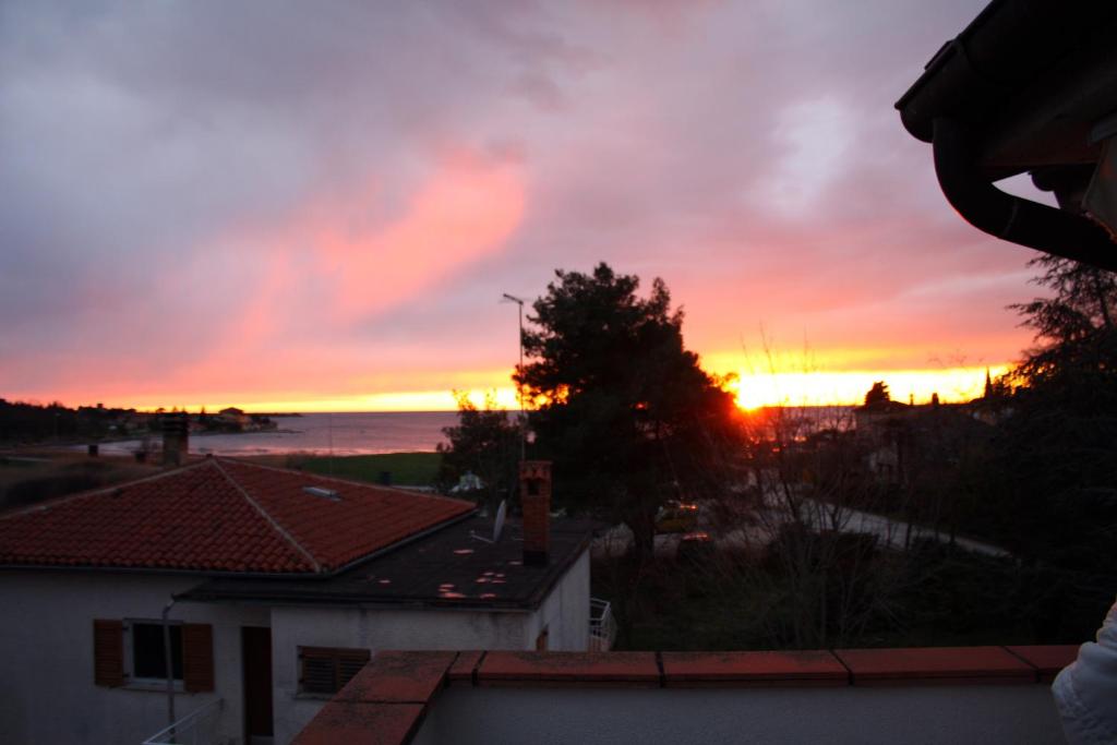 a sunset from the balcony of a house at Apartments with a parking space Karigador, Novigrad - 2534 in Karigador