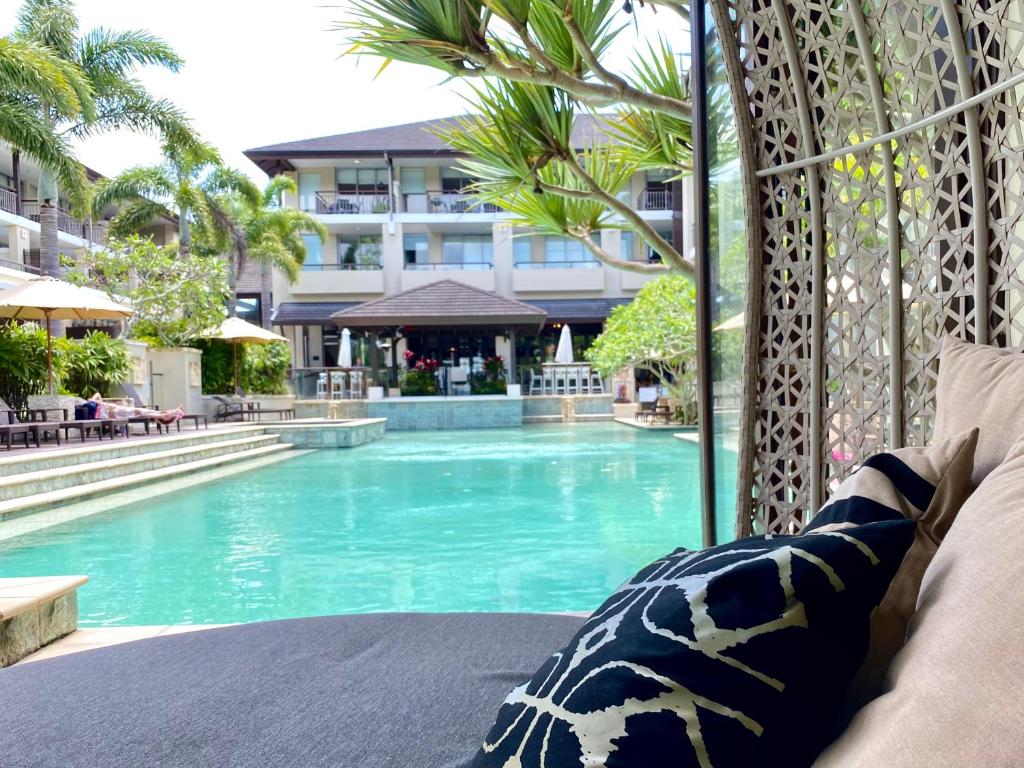a view of a swimming pool from a hotel room at 126 Santai - Ground Floor Studio Apartment by uHoliday in Casuarina