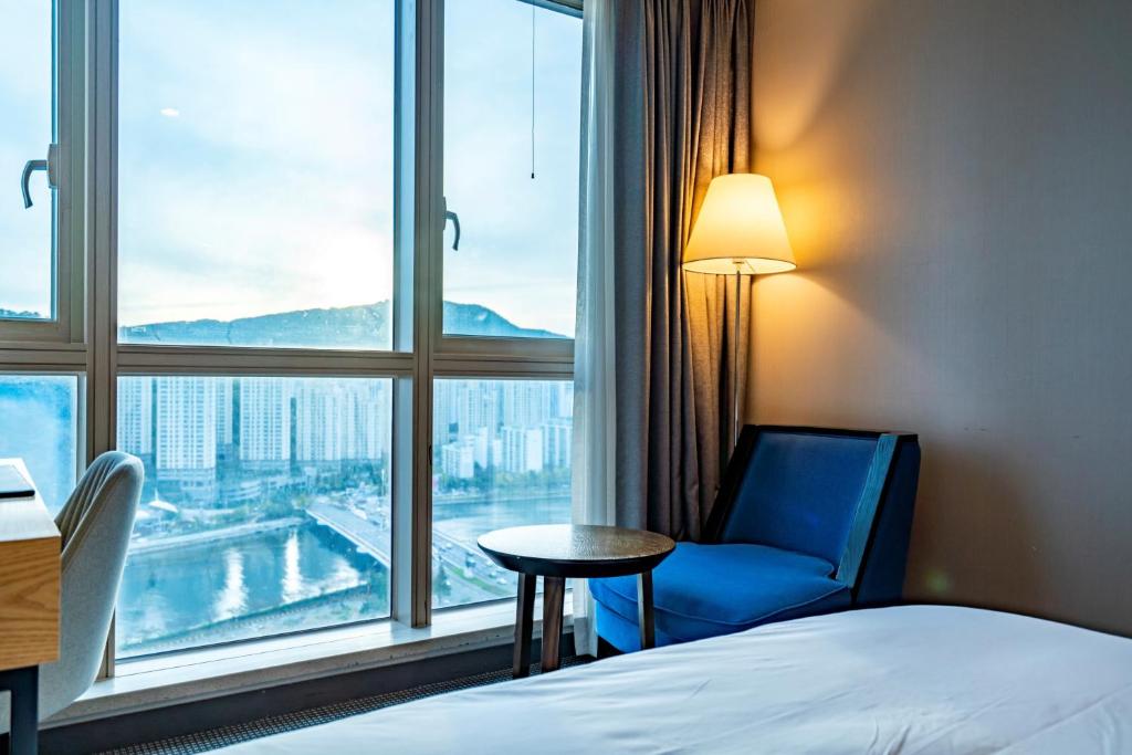 Postel nebo postele na pokoji v ubytování Centum Business Hotel