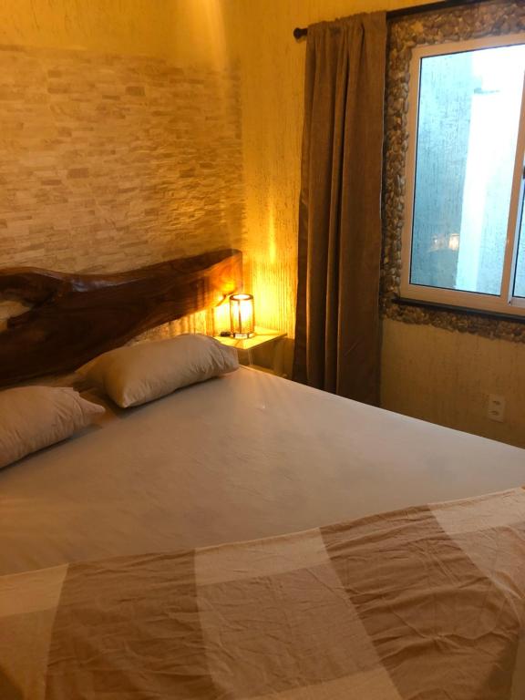Postel nebo postele na pokoji v ubytování Casita Cumbuco