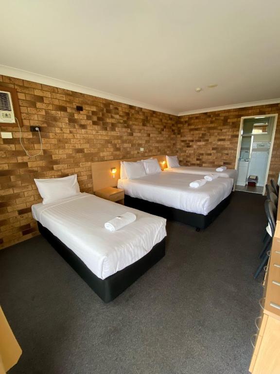 Postel nebo postele na pokoji v ubytování Maitland City Motel