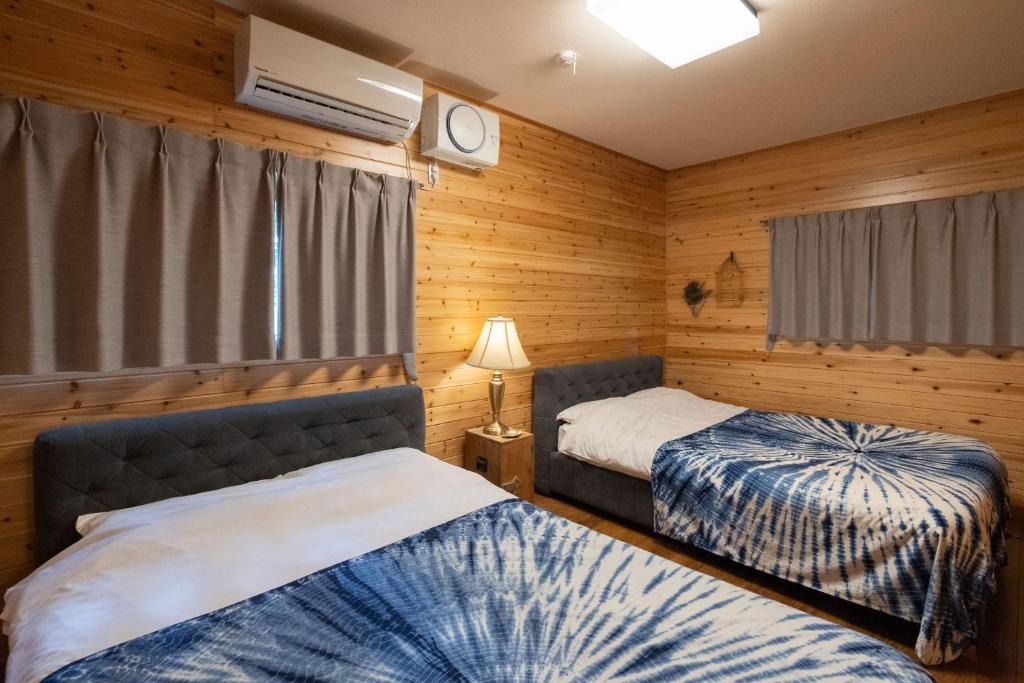En eller flere senge i et værelse på S-Villa Nasu 2nd