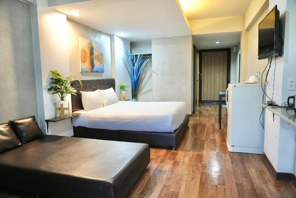 Postel nebo postele na pokoji v ubytování Bkk39 Airport hotel