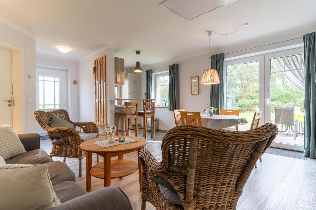 a living room with a couch and chairs and a table at FeWo Haus Friesenkind in Garding