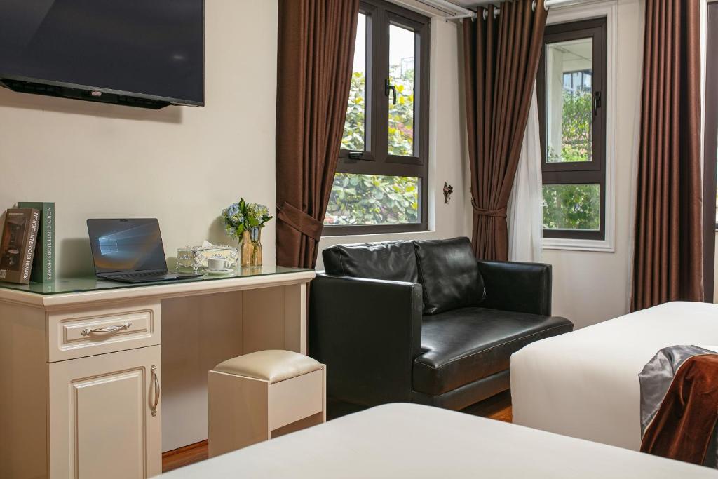 TV a/nebo společenská místnost v ubytování Tunger Grand Hotel