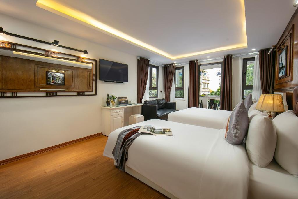 TV a/nebo společenská místnost v ubytování Tunger Grand Hotel