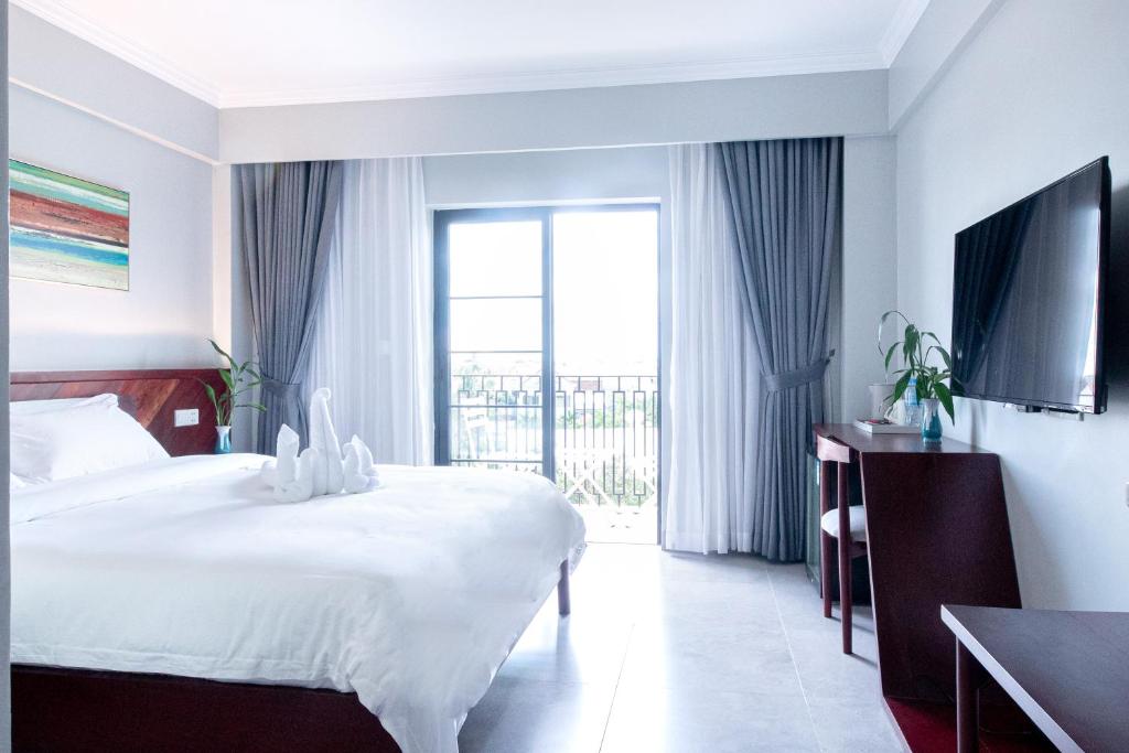 Postel nebo postele na pokoji v ubytování Solar Hotel