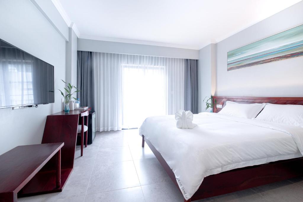 Postel nebo postele na pokoji v ubytování Solar Hotel
