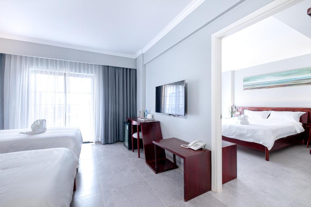 Postel nebo postele na pokoji v ubytování Solar Hotel