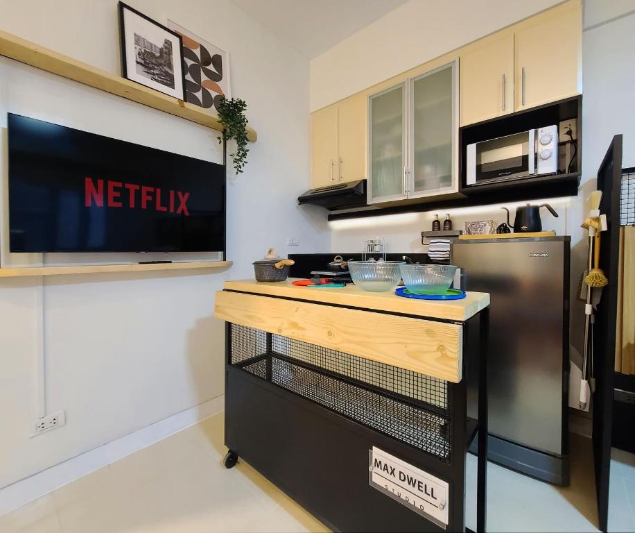 Kuchyň nebo kuchyňský kout v ubytování Relaxing Apt Bgc Business Ready with 84inch Cinema